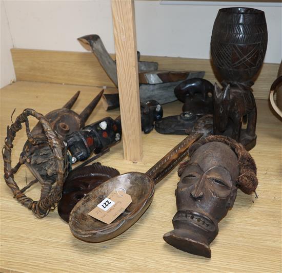 A quantity of African carvings, including a ladle and masks